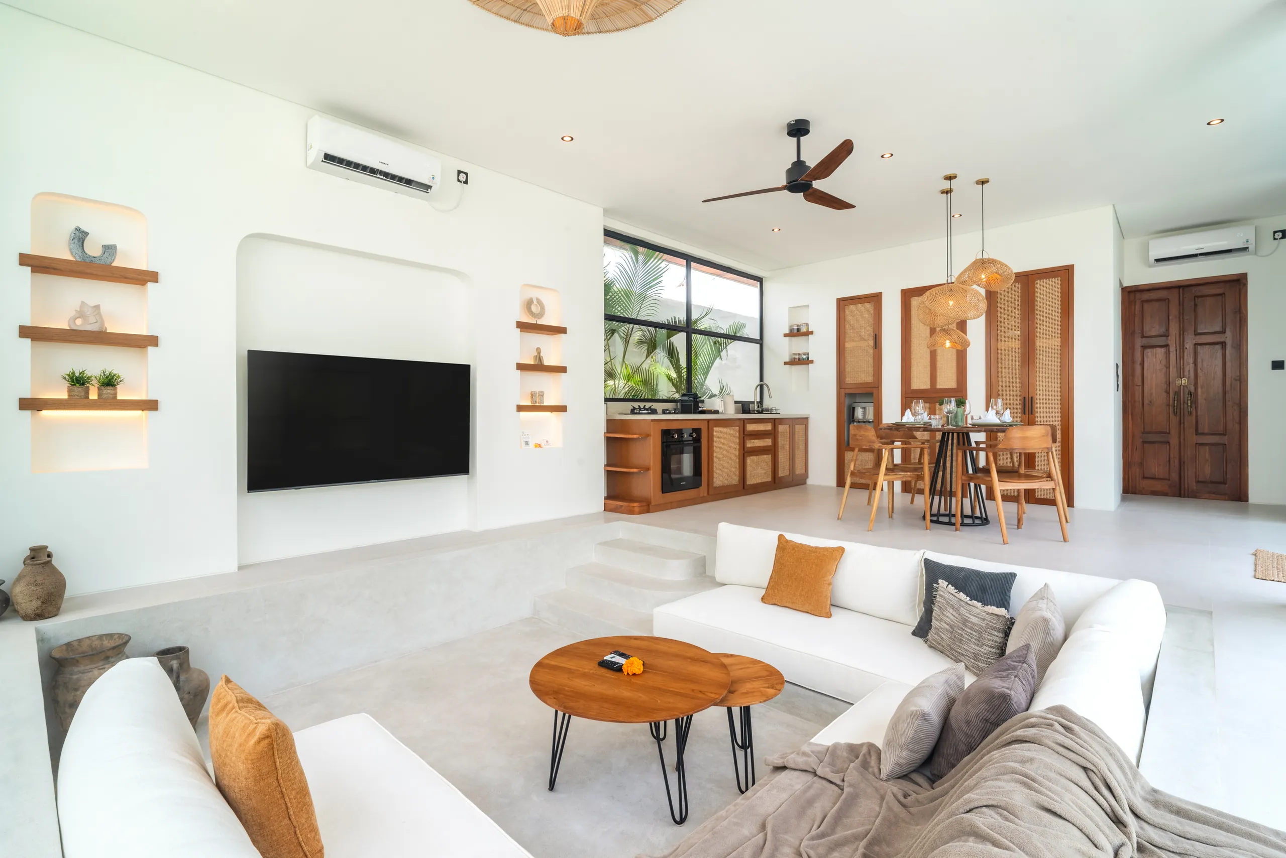 Sunken living room with Smart TV and tropical garden views at Villa Sofra