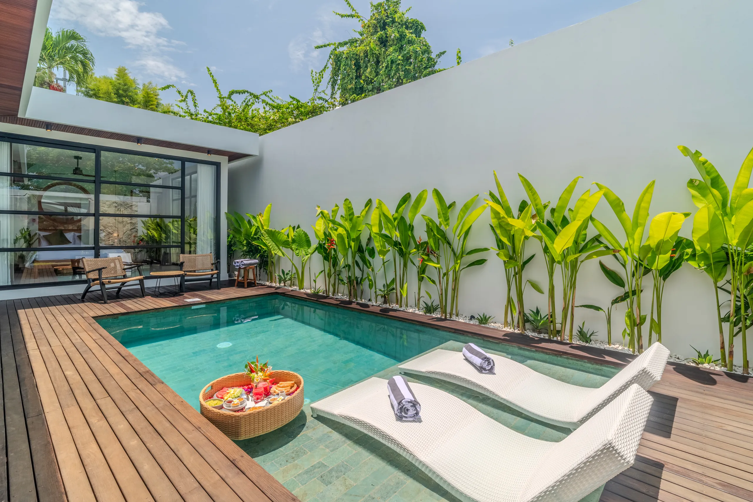 Villa exterior with private pool, sun loungers and teak deck at Villa Sofra Bingin Bali