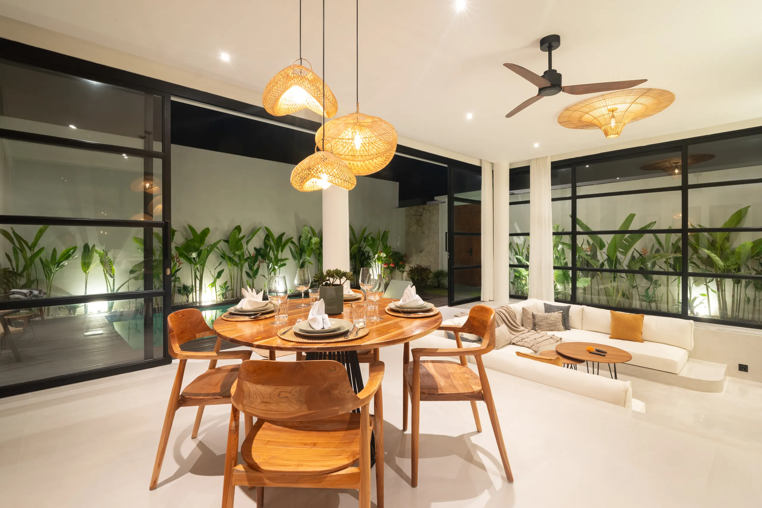 Private pool at night with teak deck and illuminated villa facade at Villa Sofra