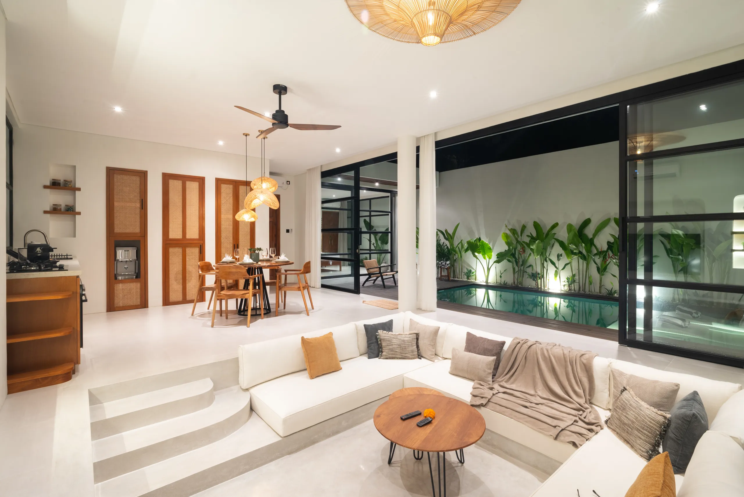 Villa exterior at night showing both wings, pool and teak deck at Villa Sofra Bingin