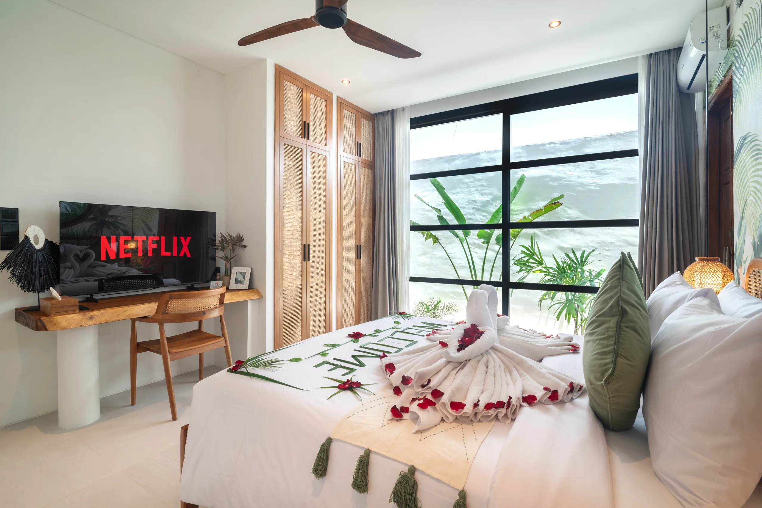 Master bedroom with Smart TV, teak wardrobe and floor-to-ceiling windows at Villa Sofra