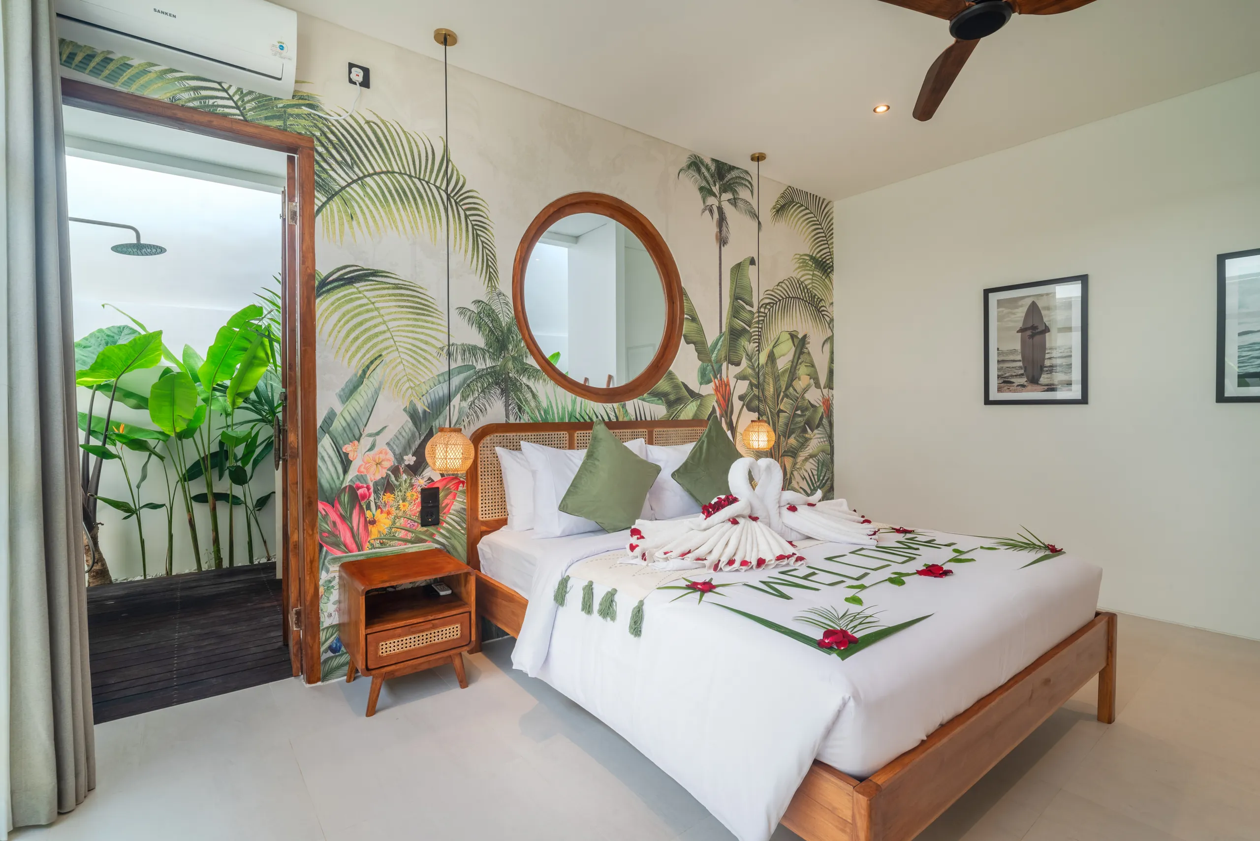 Second bedroom with tropical mural wallpaper and open semi-outdoor bathroom at Villa Sofra