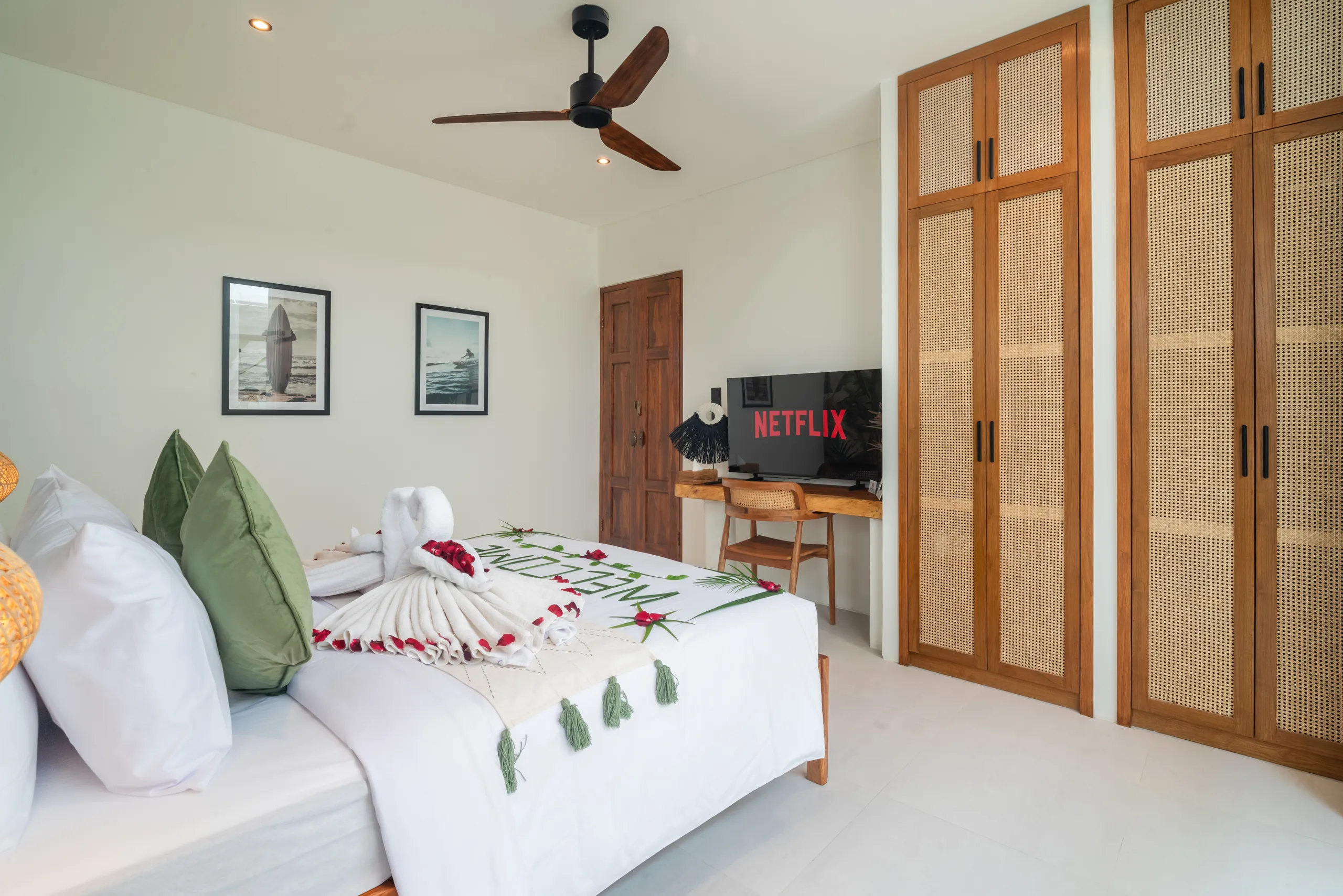 Second bedroom with rattan wardrobe, Smart TV and work desk at Villa Sofra